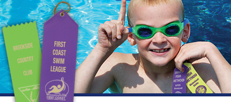 Swimming award ribbons, boy with ribbon