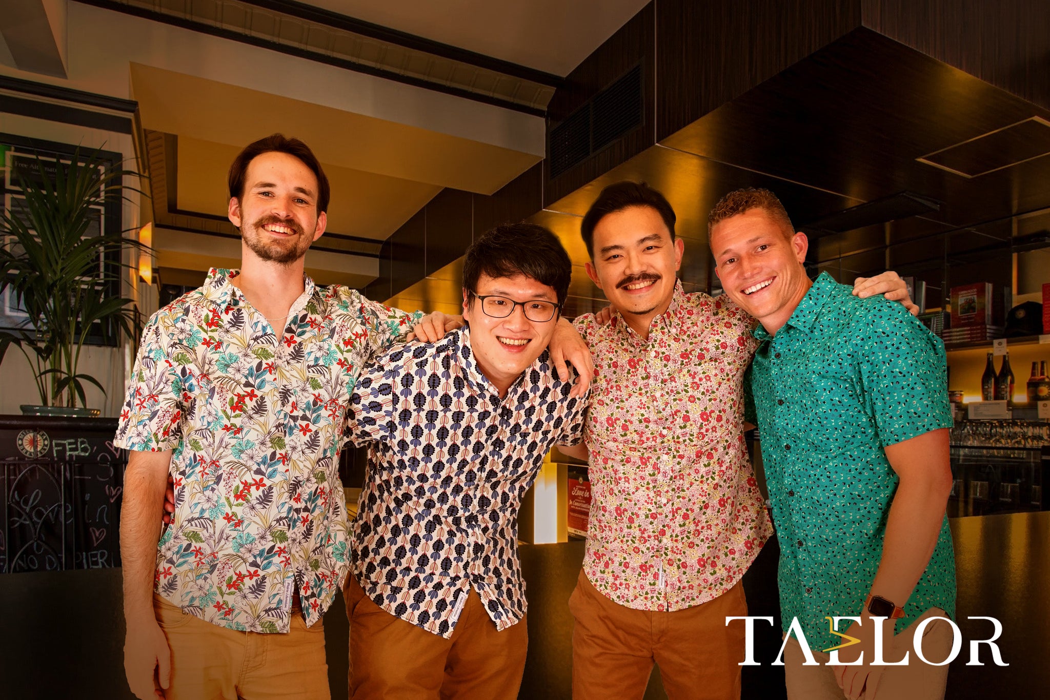 4 male models wearing Taelor floral shirts