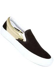 black and gold slip on vans