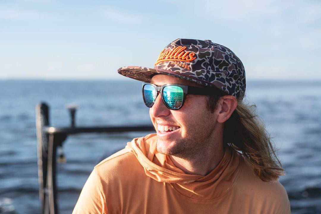 Male model wearing camo vintage rope cap.