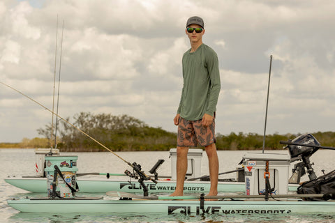 Angler wearing the Icon long sleeve fishing shirt.