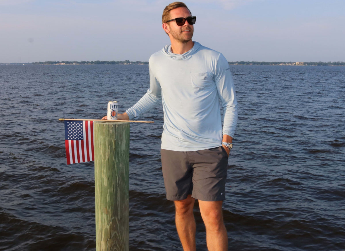 Model wearing the light ocean blue angler bamboo hoodie.