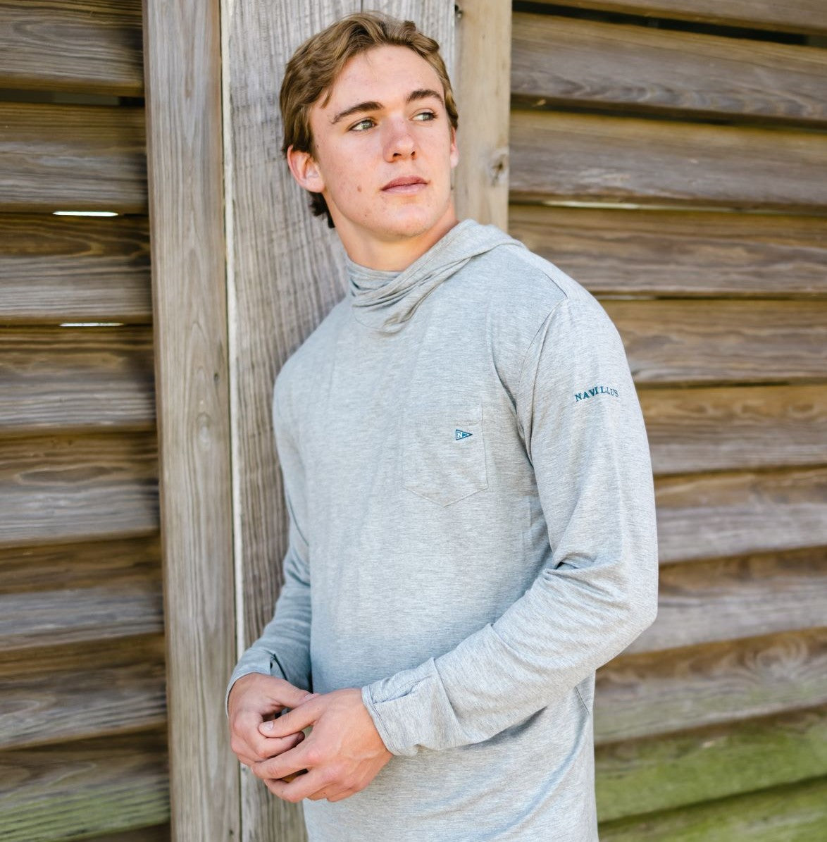 Model wearing the Angler Crossover Bamboo Hoodie in Heather Grey.