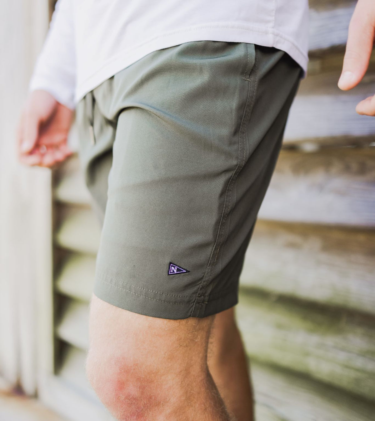 Model wearing the Sabalo Fishing Shorts in Olive.