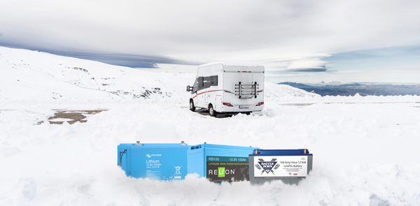 Batteries in the snow in front of a RV 