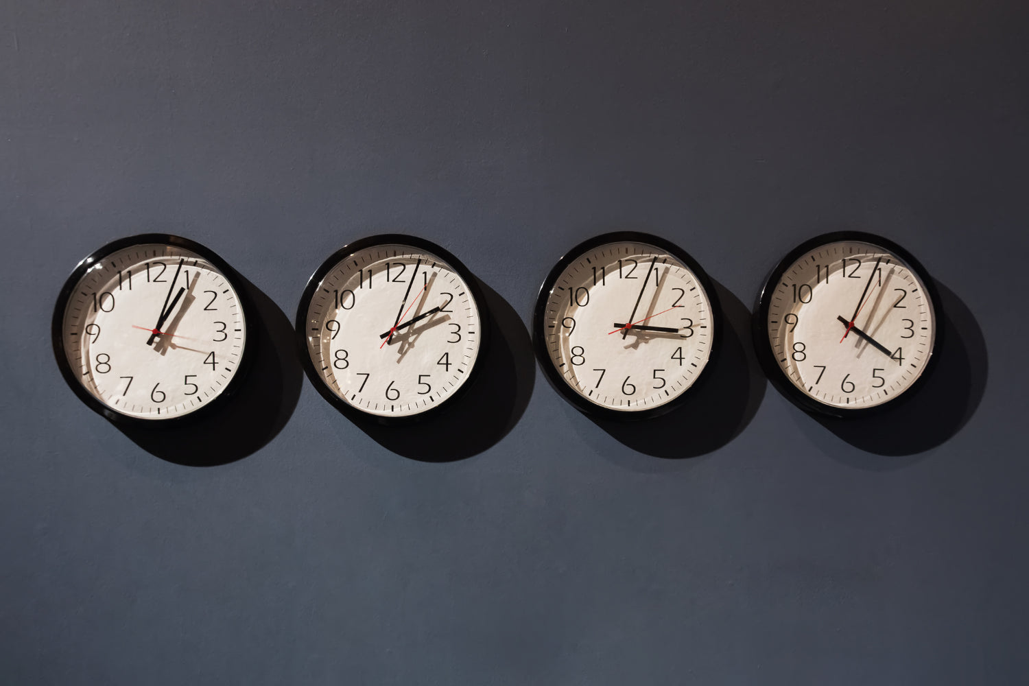 Several clocks with different times.