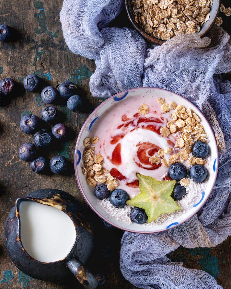 Small portion snacks like Greek yogurt with berries.