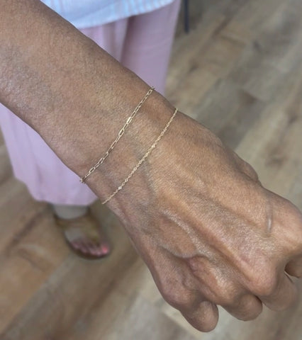 old woman showing permanent bracelet