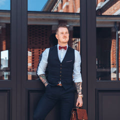 well dressed man with dark red cork bow tie