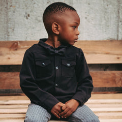 boy wearing black shirt and black bow tie