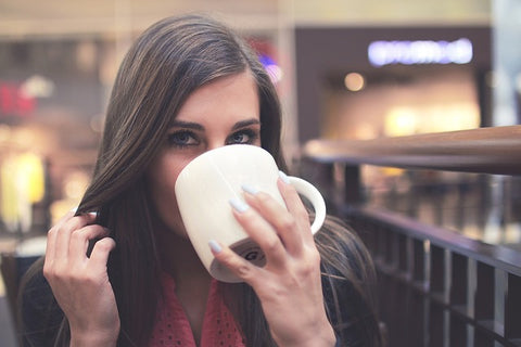 Woman drinking coffee from a mug