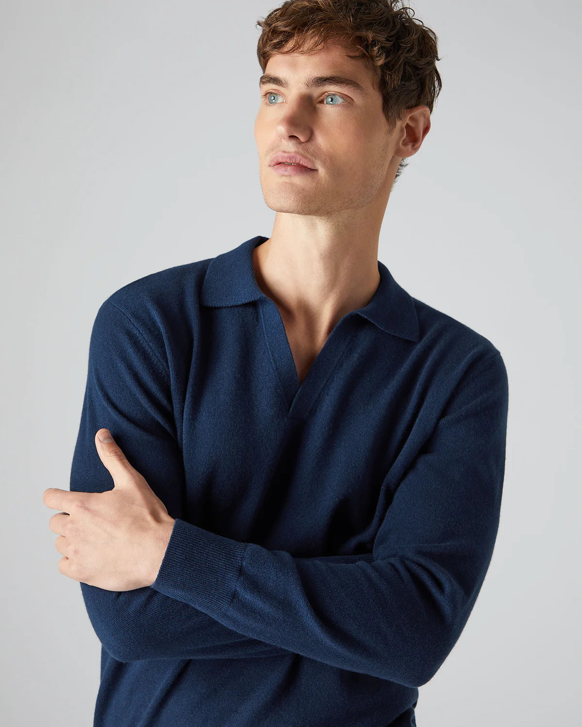 man wearing navy long-sleeve polo shirt