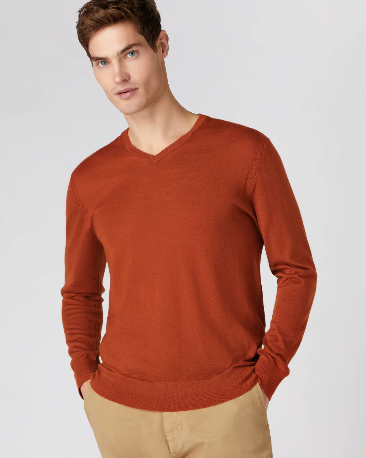 man wearing tanned v-neck jumper