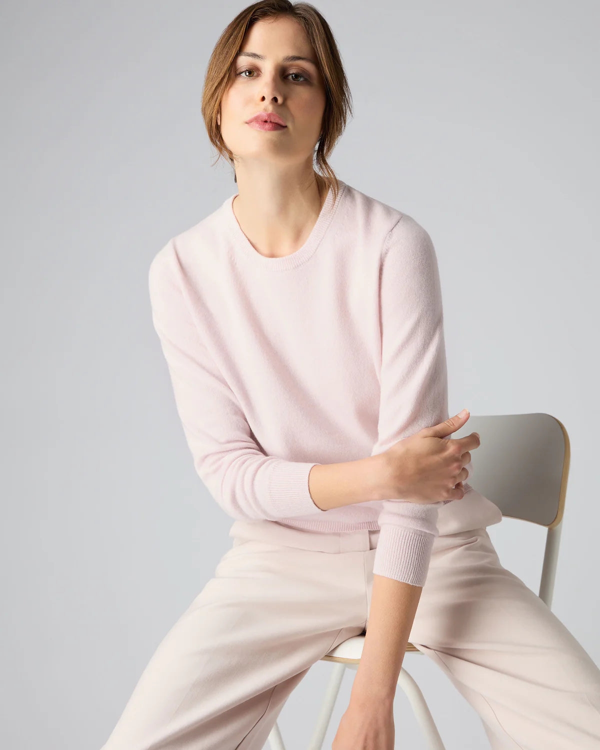 women wearing salmon colour round neck jumper