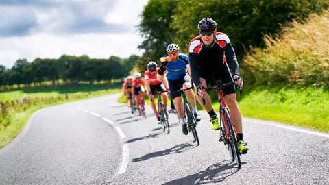 Multiple cyclists on the open road