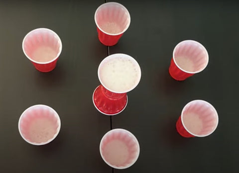 cirlce of cups with a bigger cup in the middle