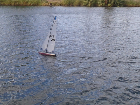 Taking fiberglass RC yacht out to sail.