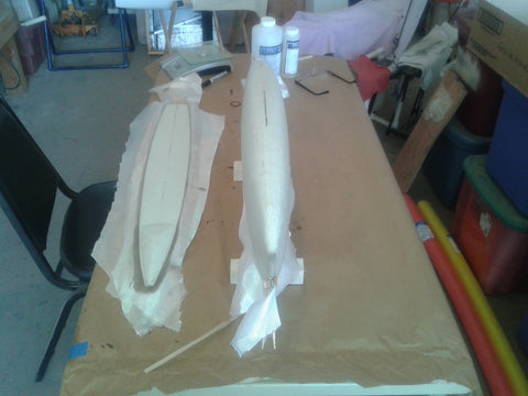 Laminating fiberglass fabric to the hull of an RC yacht