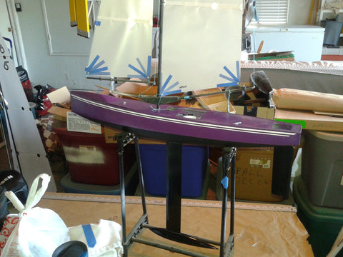 Fiberglass RC Yacht with new purple paint.