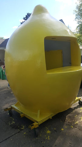 Newly repaired fiberglass and gel coat on yellow lemonade stand.