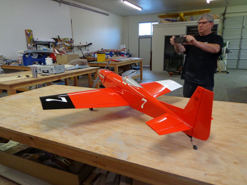 Orangish red fiberglass RC mustang plane