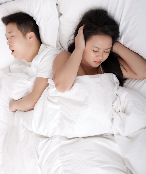 Asian male with sleep apnea snoring waking up partner