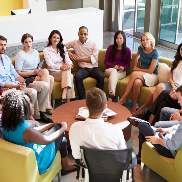 Coworkers Sitting Around a Circular Table