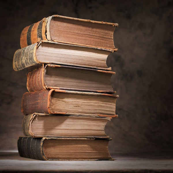 A Stack of Old Books on a Table