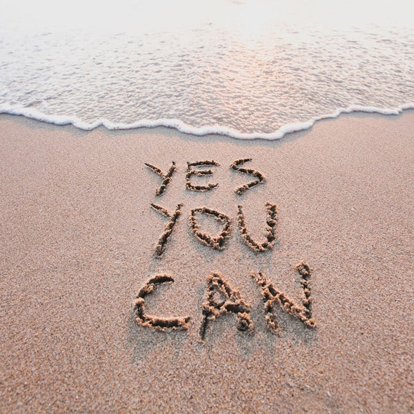 "Yes You Can" Written in the Sand on a Beach