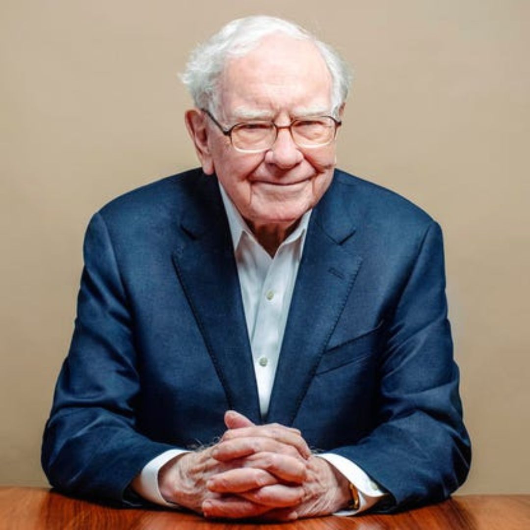A professional business photograph of legendary value investor Warren Buffett.
