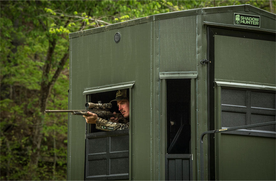 aiming rifle from blind