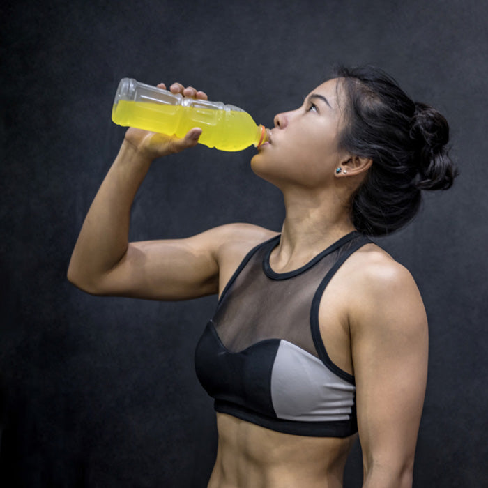 Woman drinking sports drink