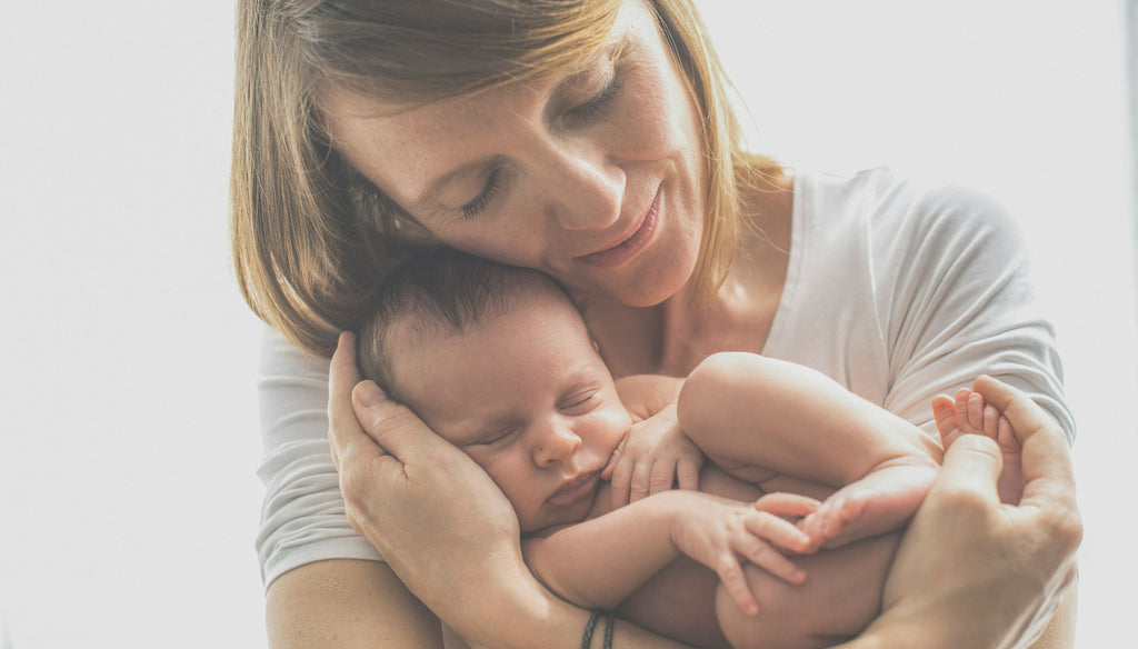 Mother holding her baby