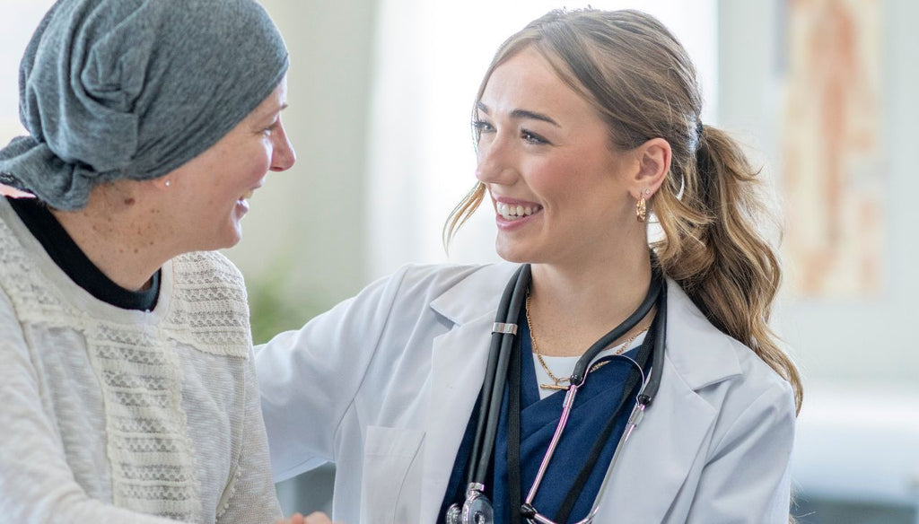 Patience with cancer talking with her health practitioner