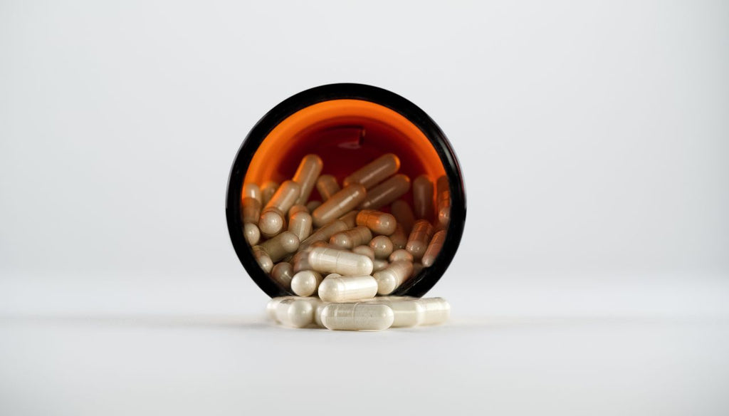 Boswellia bottle with all the capsules on the table