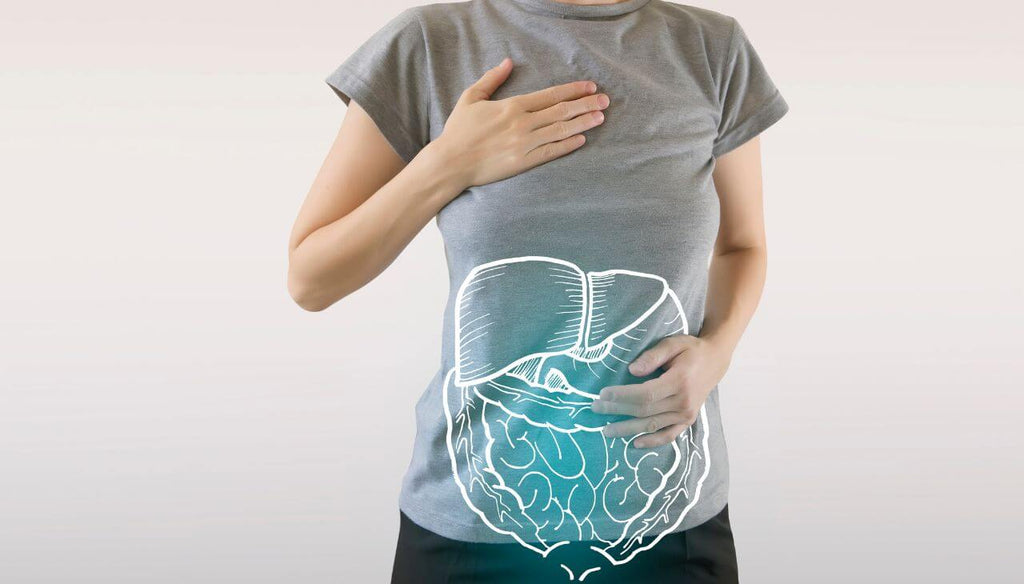A woman touching her belly that has a good digestion.