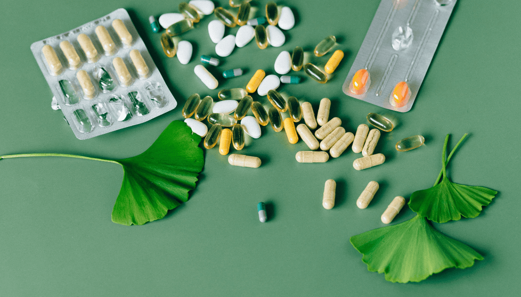 Organic supplements laying on a green table