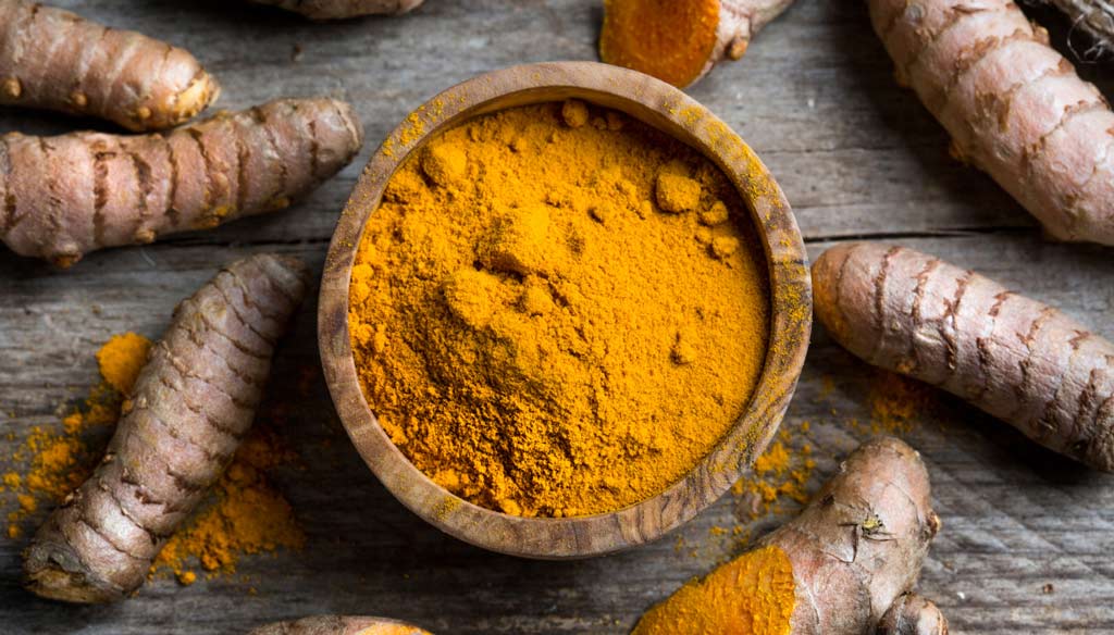 turmeric powder and rhyzome - tribe organics