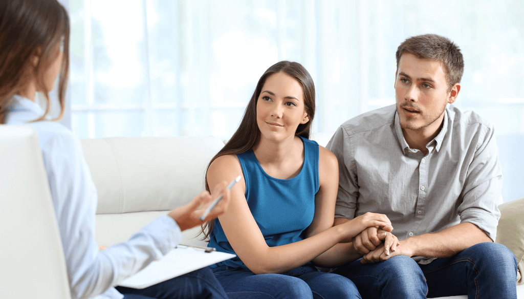 Couple talking to a health professional