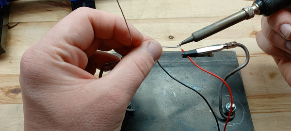 Tinning the 9 volt battery connector's wires