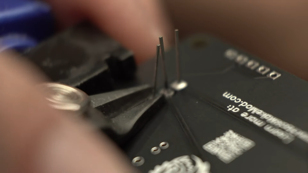 Flush cutting the legs of a transistor