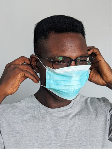 man wearing face mask with glasses