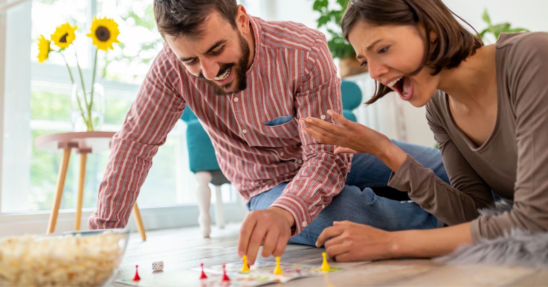 A couple playing a board game