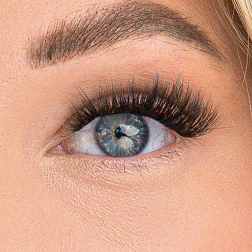 A close up of a blue eye with WinkClique POSH lashes on.