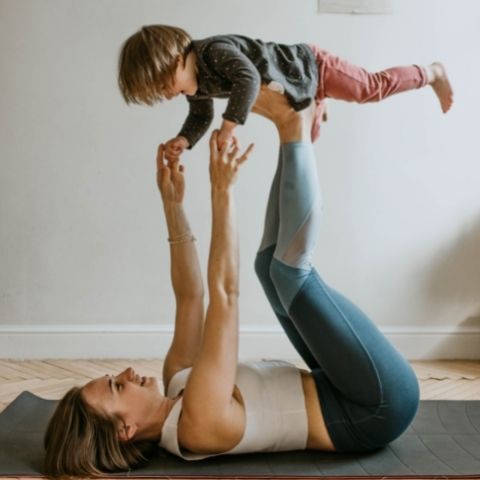 Mom with kids on her feet