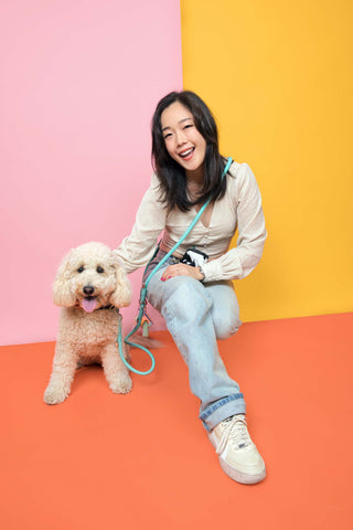 Million dogs owner Jisuk and her mini golden doodle Daisy posing