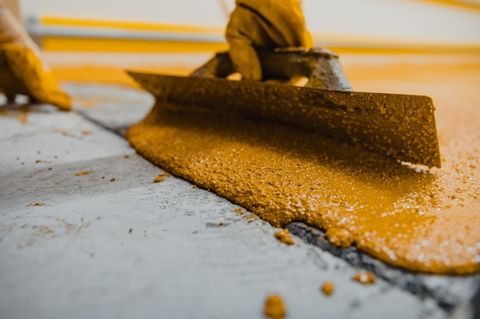 yellow anti slip floor paint with a rough texture 