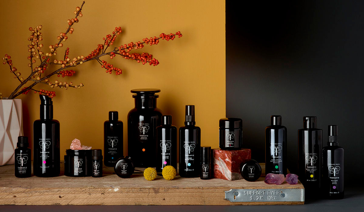 An arrangement of the full THERAPIE apothecary range of wellbeing products