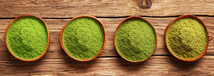 bowls with matcha green tea powder in different grades