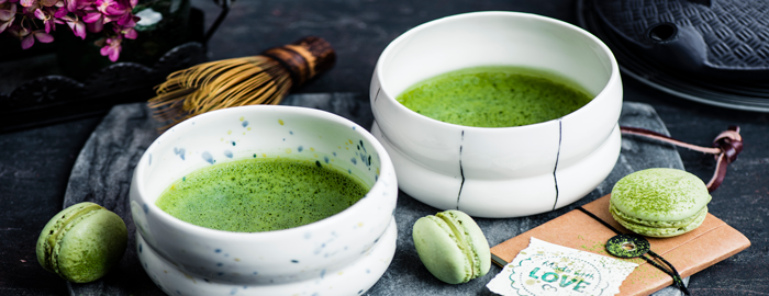 serving matcha green tee in bowl for two with matcha macaroons